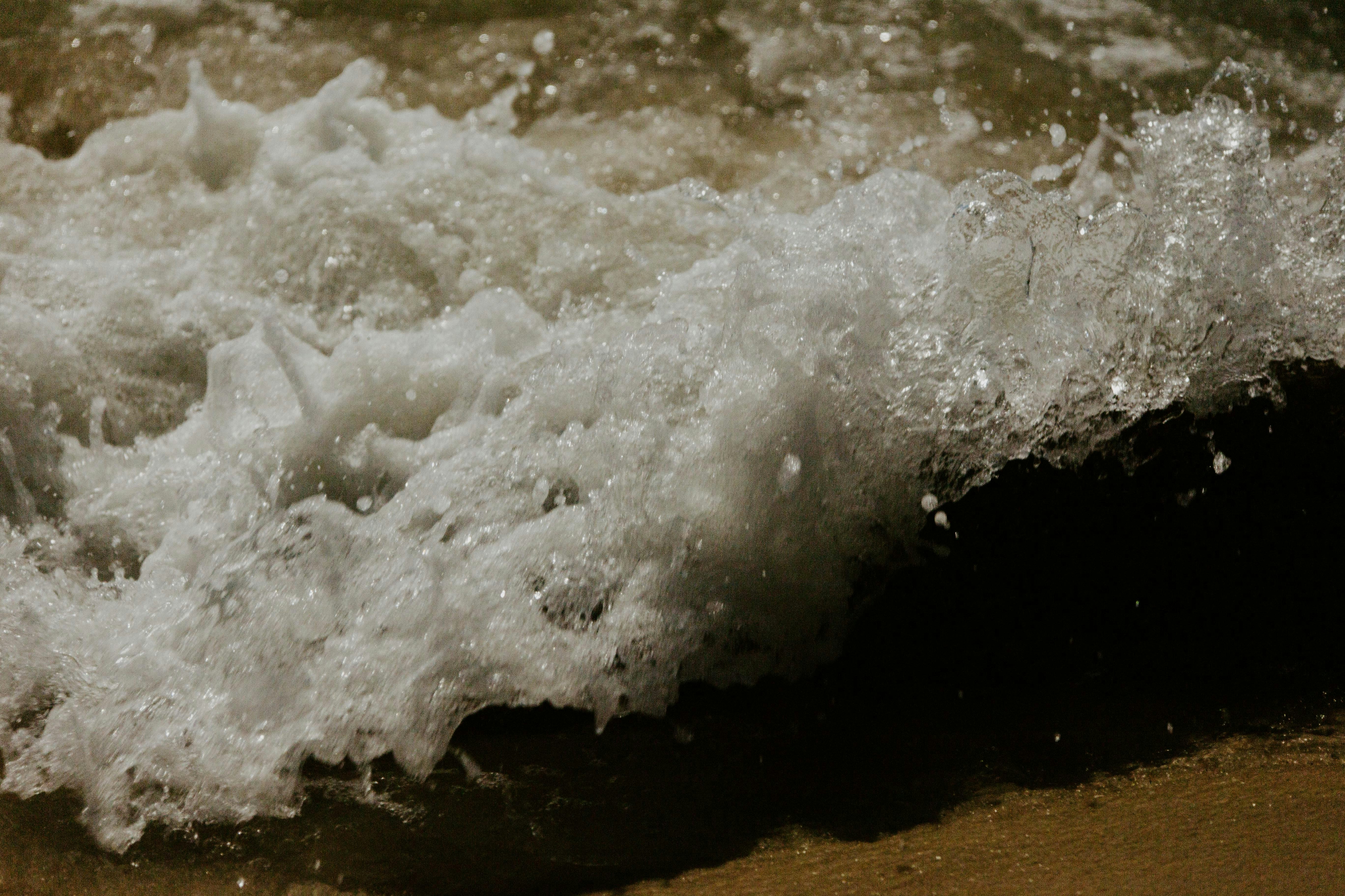 water waves on brown sand